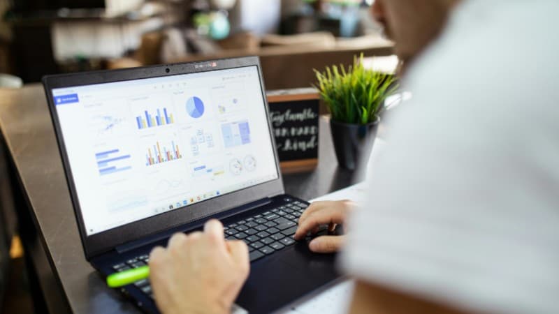 Focused business analysis with charts and graphs on a laptop in a modern office setting., tags: geo heatmaps casino affiliate - pexel